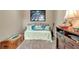 Bedroom featuring daybed, stylish decor, and Beatles artwork to create a cozy and inviting space at 1322 Perico Point Cir, Bradenton, FL 34209