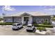 Exterior of clubhouse with parking, landscaping and accessible entrance at 1322 Perico Point Cir, Bradenton, FL 34209