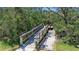 Scenic wooden pier surrounded by lush greenery at water's edge at 1322 Perico Point Cir, Bradenton, FL 34209