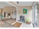 The living room is adjacent to the sunroom with carpet flooring and lots of natural light at 1322 Perico Point Cir, Bradenton, FL 34209