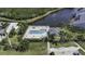 Aerial view showcasing a swimming pool, hot tub, lounge chairs, and landscaping in a community at 1322 Perico Point Cir, Bradenton, FL 34209