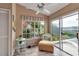 Cozy sunroom with large windows providing lots of natural light and neighborhood views at 1322 Perico Point Cir, Bradenton, FL 34209
