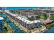 Aerial view of waterfront condos with boat docks, landscaping and beautiful water views at 1350 N Portofino Dr # 208, Sarasota, FL 34242
