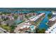 Aerial view showcasing the waterfront condos with boat docks and community pool at 1350 N Portofino Dr # 208, Sarasota, FL 34242