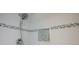 Updated shower features sleek tiling and convenient storage niche at 1350 N Portofino Dr # 208, Sarasota, FL 34242