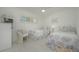 Bright bedroom featuring twin beds and coordinated decor at 1350 N Portofino Dr # 208, Sarasota, FL 34242