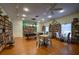 Community library and game room with bookshelves, tables, and chairs for residents to gather and enjoy at 1350 N Portofino Dr # 208, Sarasota, FL 34242