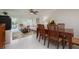 Open-concept dining room leading to living room and screened balcony at 1350 N Portofino Dr # 208, Sarasota, FL 34242