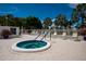 Relaxing hot tub area with plenty of seating and lush landscaping to unwind and enjoy resort-style living at 1350 N Portofino Dr # 208, Sarasota, FL 34242
