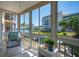 Bright screened lanai with water views and comfortable seating at 1350 N Portofino Dr # 208, Sarasota, FL 34242