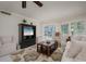 Cozy living room with plush seating and a view of the screened balcony at 1350 N Portofino Dr # 208, Sarasota, FL 34242