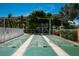 Active lifestyle: Enjoy shuffleboard courts for recreation and community engagement under sunny skies at 1350 N Portofino Dr # 208, Sarasota, FL 34242