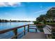 The community pier offers scenic waterfront views of the water, buildings, and lush surroundings at 1350 N Portofino Dr # 208, Sarasota, FL 34242
