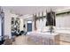 Open concept kitchen with marble island, sleek appliances, and adjacent seating area with stylish decor at 1384 Harbor Dr, Sarasota, FL 34239