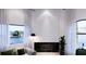The living room has a fireplace with a black marble surround and a view of the water at 1384 Harbor Dr, Sarasota, FL 34239