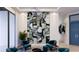 Stunning living room with stylish seating, decorative stone feature wall, and modern chandelier at 1384 Harbor Dr, Sarasota, FL 34239
