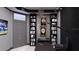 The office features built-in bookshelves, a television, and custom artwork at 1384 Harbor Dr, Sarasota, FL 34239