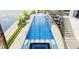 Aerial view of the sparkling pool with a built-in spa, palm trees, and outdoor lounge area at 1384 Harbor Dr, Sarasota, FL 34239