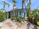 Exterior of property with lush, tropical landscaping and a quaint patio at 170 Roosevelt Dr # 2, Sarasota, FL 34236