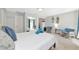 Sun-filled studio boasts a bed, mirrored closet, surf decor, and chairs for lounging and relaxation at 170 Roosevelt Dr # 2, Sarasota, FL 34236