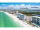 Beautiful aerial view of beachfront condos and beach with the ocean in the background at 1770 Benjamin Franklin Dr # 407, Sarasota, FL 34236