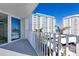 View from balcony featuring the beach and neighboring high-rise buildings at 1770 Benjamin Franklin Dr # 407, Sarasota, FL 34236