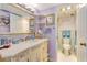 Stylish bathroom featuring a vanity with a sink, ample countertop space, and a nearby toilet for convenience at 1770 Benjamin Franklin Dr # 407, Sarasota, FL 34236