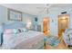 Bright bedroom with a cozy bed, a soft color palette, and an ensuite bathroom for added privacy at 1770 Benjamin Franklin Dr # 407, Sarasota, FL 34236