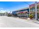 Commercial street view with a variety of shops, restaurants, and street benches for a shopping experience at 1770 Benjamin Franklin Dr # 407, Sarasota, FL 34236