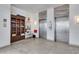 Modern elevators with updated decor in well-maintained lobby at 1770 Benjamin Franklin Dr # 407, Sarasota, FL 34236