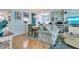 Cozy living area with coastal decor, a dining table, and a comfortable sofa with bright natural light at 1770 Benjamin Franklin Dr # 407, Sarasota, FL 34236