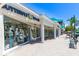 Charming Butterfly Beach storefront with a wide display window and a welcoming entrance, dog friendly at 1770 Benjamin Franklin Dr # 407, Sarasota, FL 34236