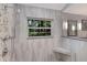 Beautiful bathroom shower with a window bringing in tons of natural light at 1780 Pine Harrier Cir, Sarasota, FL 34231