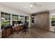 Office/Bedroom with a built-in wall bed, desk area, and lots of natural light at 1780 Pine Harrier Cir, Sarasota, FL 34231