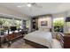 Bedroom with a built-in wall bed, lots of windows, and natural light at 1780 Pine Harrier Cir, Sarasota, FL 34231