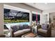 Comfortable screened porch with plush seating overlooking the pool and lush backyard, ideal for outdoor living at 1780 Pine Harrier Cir, Sarasota, FL 34231