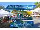 Wooden sign advertising local goods at the Siesta Key Farmers Market at 1780 Pine Harrier Cir, Sarasota, FL 34231