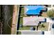 Aerial view of backyard featuring well-kept lawn, fence, and waterfront view at 2330 28Th E Ave, Palmetto, FL 34221