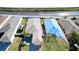 Aerial view of a home highlighting roofline, backyard, and surrounding neighborhood at 2330 28Th E Ave, Palmetto, FL 34221