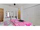 Bright bedroom with a large closet, mirror, and playful decor at 2330 28Th E Ave, Palmetto, FL 34221