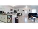Spacious open-concept living space featuring tile floors, bright walls, and access to kitchen and living room at 2330 28Th E Ave, Palmetto, FL 34221
