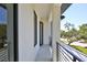 Exterior balcony with minimalist railings offering neighborhood views at 2335 Oak Ter, Sarasota, FL 34231
