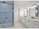 Modern bathroom features double vanity and glass walk-in shower at 2335 Oak Ter, Sarasota, FL 34231