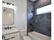 Modern bathroom featuring hexagon tile shower, a tub, and sleek fixtures, creating a stylish and functional space at 2335 Oak Ter, Sarasota, FL 34231