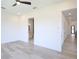 Open bedroom layout showcasing hardwood floors and easy access to the ensuite bathroom and hallway at 2335 Oak Ter, Sarasota, FL 34231
