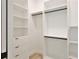 A well-organized closet boasts ample shelving, drawers, and hanging rods for optimal storage solutions at 2335 Oak Ter, Sarasota, FL 34231