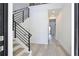 Bright entryway with wood floors and a staircase featuring modern black railings at 2335 Oak Ter, Sarasota, FL 34231