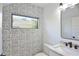 Charming half-bathroom featuring whimsical wallpaper and a modern vanity with a black faucet at 2335 Oak Ter, Sarasota, FL 34231