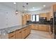 Gourmet kitchen features a spacious island, stainless steel appliances, and custom cabinetry at 2335 Oak Ter, Sarasota, FL 34231