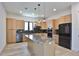 Gourmet kitchen features a spacious island, stainless steel appliances, and custom cabinetry at 2335 Oak Ter, Sarasota, FL 34231